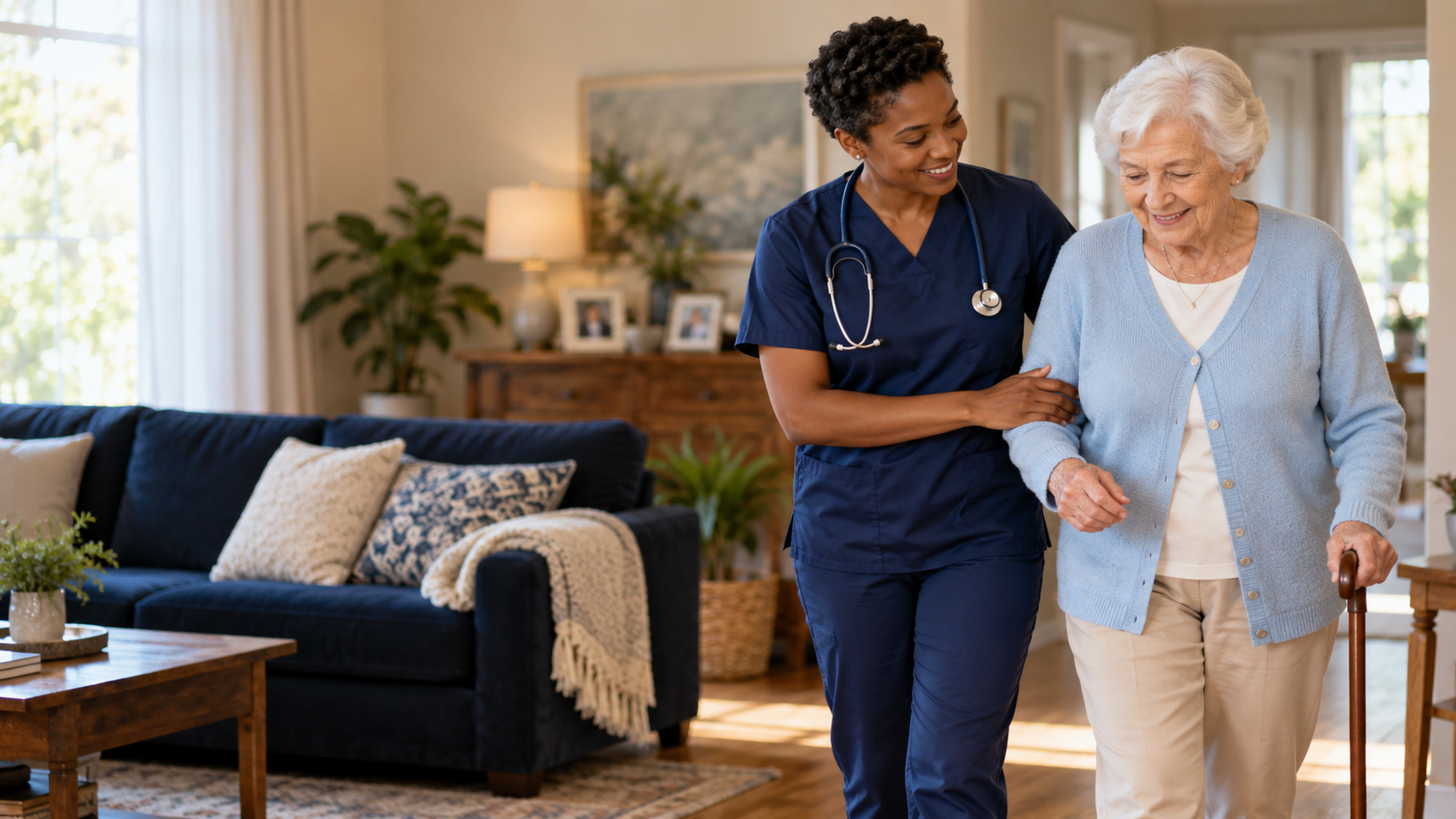Home health nurse helping an older woman walk through her living room